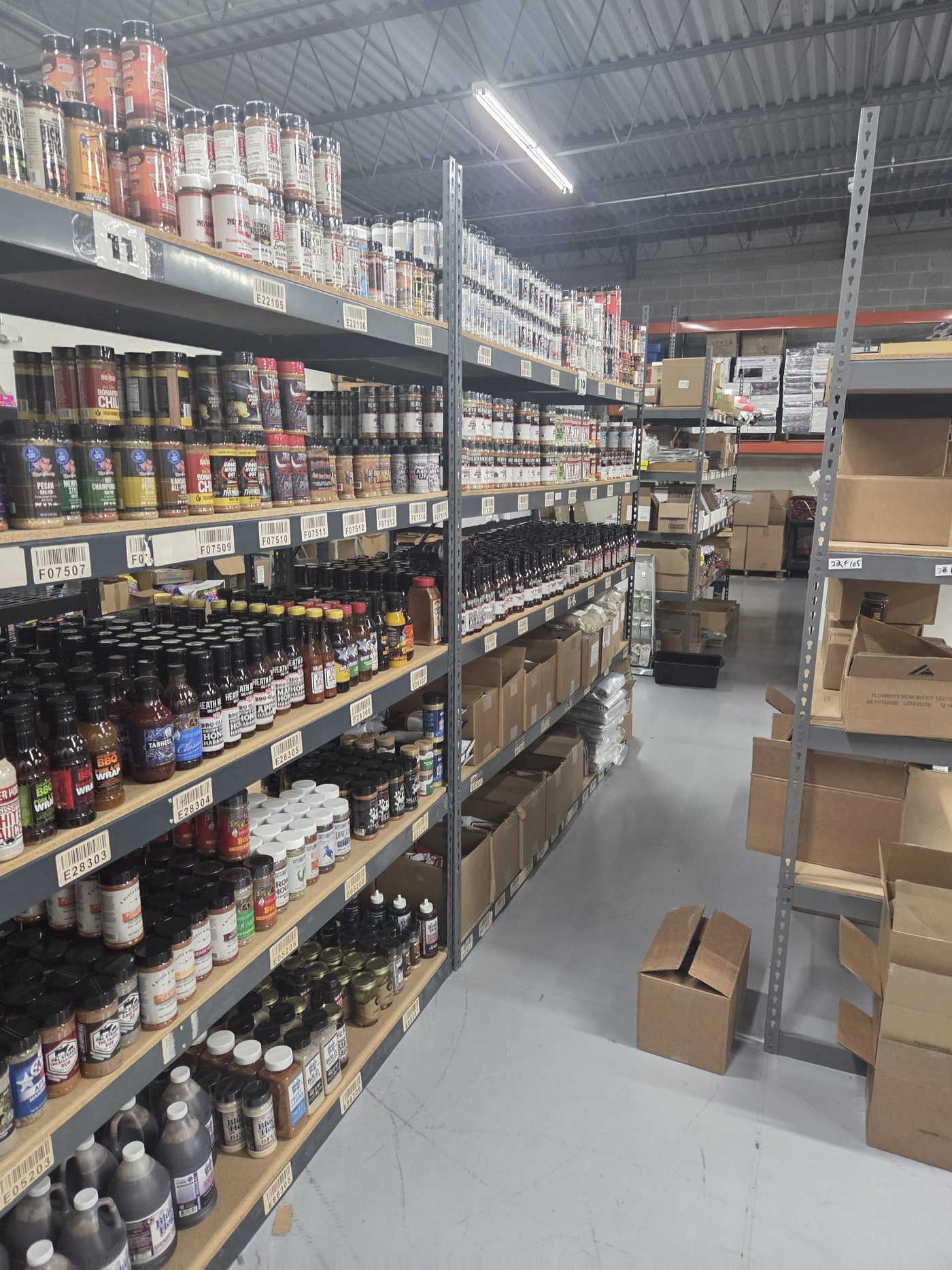 Organized inventory aisle, receiving to shipping under one roof